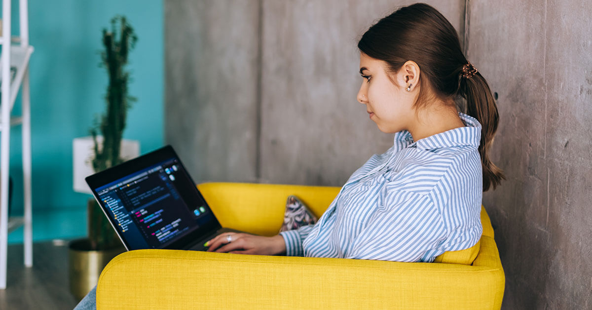 female software developer working in modern office space